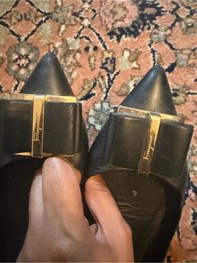 Salvatore Ferragamo Black Pointed-Toe Leather Bow Flats with Gold Hardware